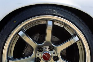Detailed close-up shot of an alloy wheel and tire on a modified car.